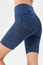 Blue denim shorts on a white background
