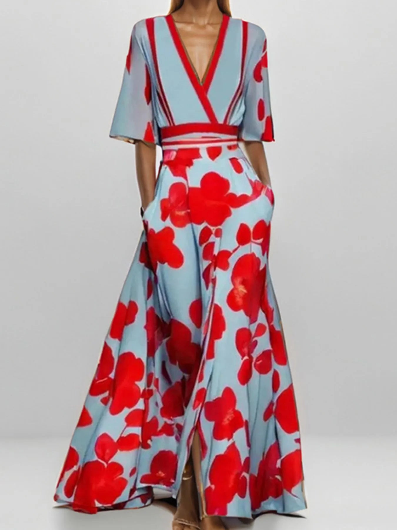 Woman wearing a floral dress with red flowers on a light blue background
