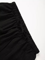 Black fabric with ruched texture on a white background