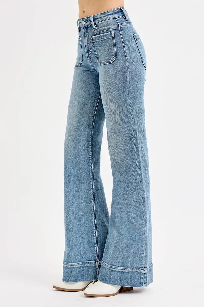 Light blue flared jeans on a white background