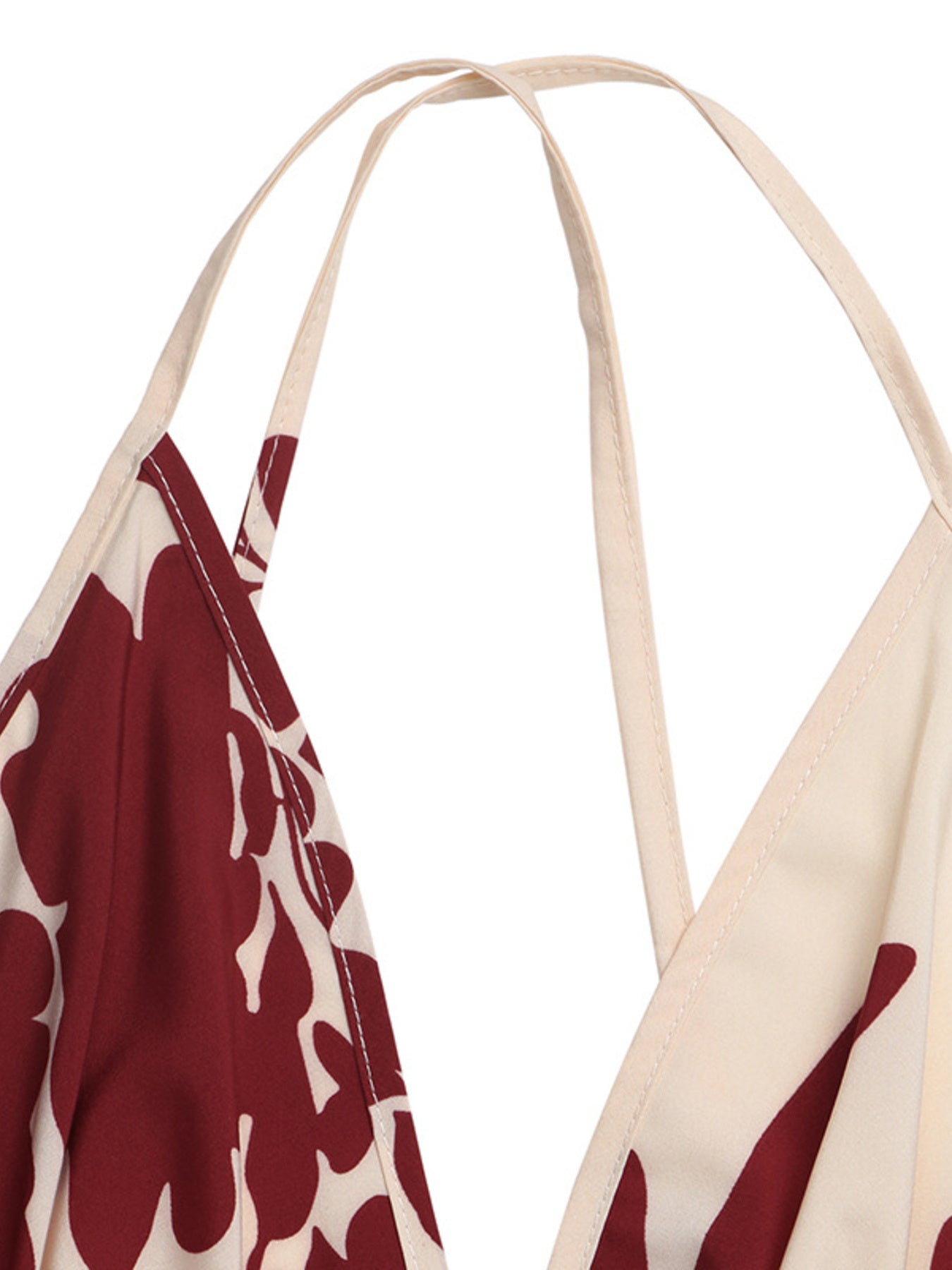 Beige and red patterned apron with straps on a white background