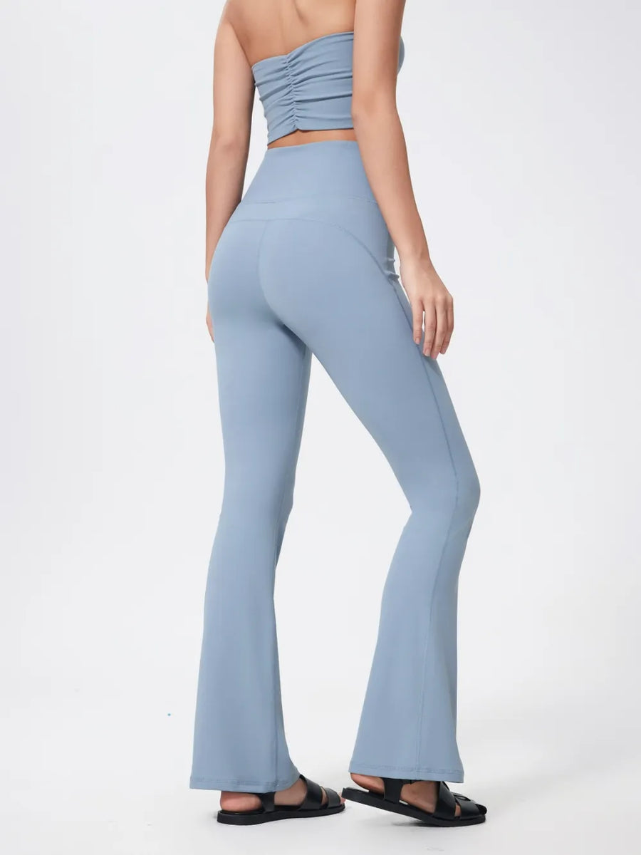 Light blue strapless top and flared pants on a white background