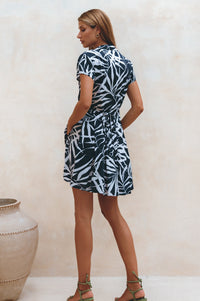 Woman showing the back of Agnes Shirt Dress