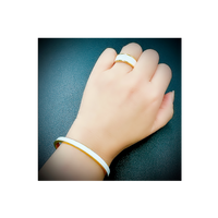 Woman wearing B.Tiff "The Hamptons" White Enamel Gold Bangle Bracelet