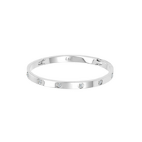 A polished silver bangle bracelet with eight stone accents, arranged in a pattern around the bracelet.