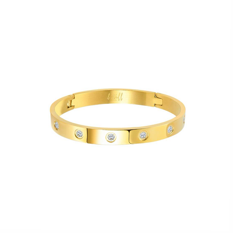 A bold high polish gold bangle bracelet with eight embedded round-cut diamonds, showcasing a shiny metallic finish.