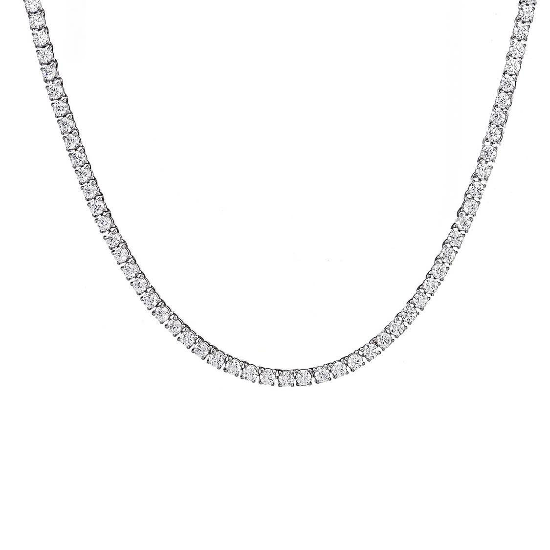 A tennis necklace with silver color and clear cubic zirconia stones.