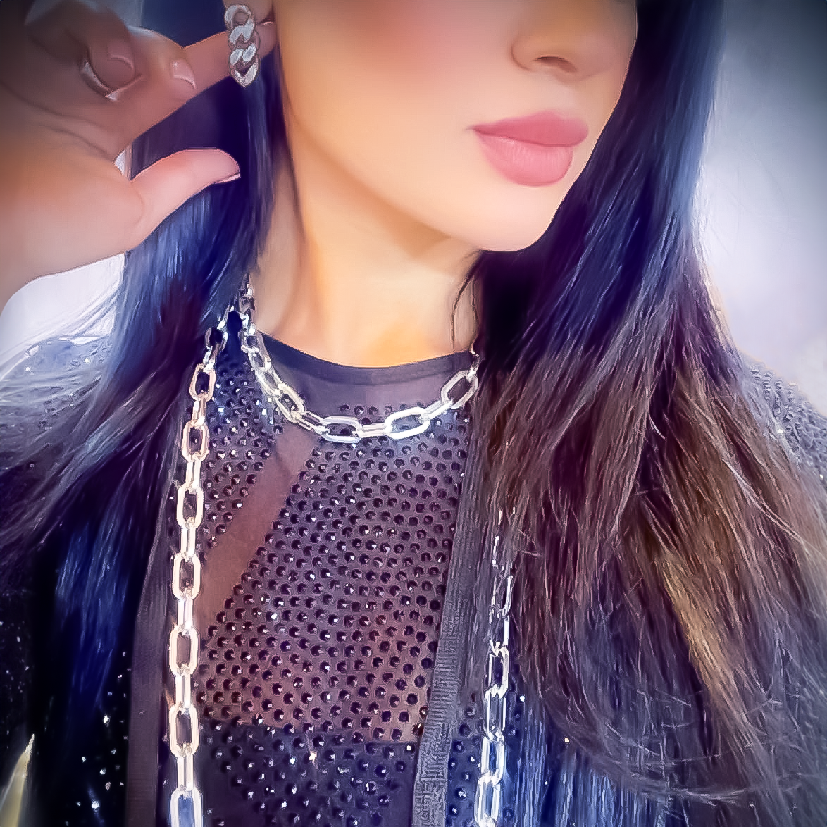 A lady wearing B.Tiff High Polish Paperclip Chain Necklace