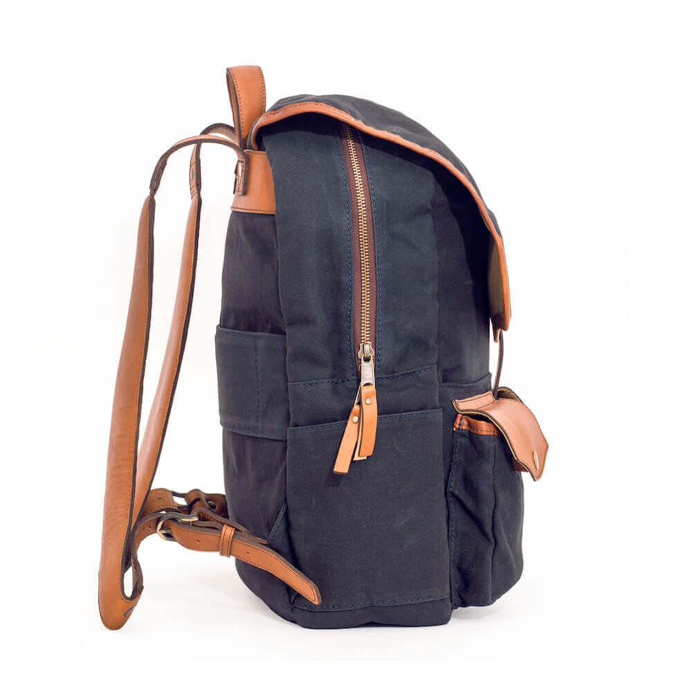 Side view of black Campaign Waxed Canvas Backpack by Mission Mercantile Leather Goods