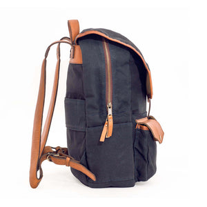 Side view of black Campaign Waxed Canvas Backpack by Mission Mercantile Leather Goods