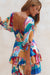 Another view from the back of Cha-Cha Ruffle Mini Dress -havana