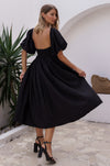 Model showing full view of black Cherie Puff Sleeve Midi Dress