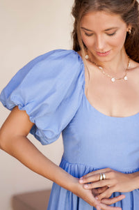 Model showing the sleeve of Cherie Puff Sleeve Midi Dress