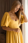 Model showing mustard Cherie Puff Sleeve Midi Dress