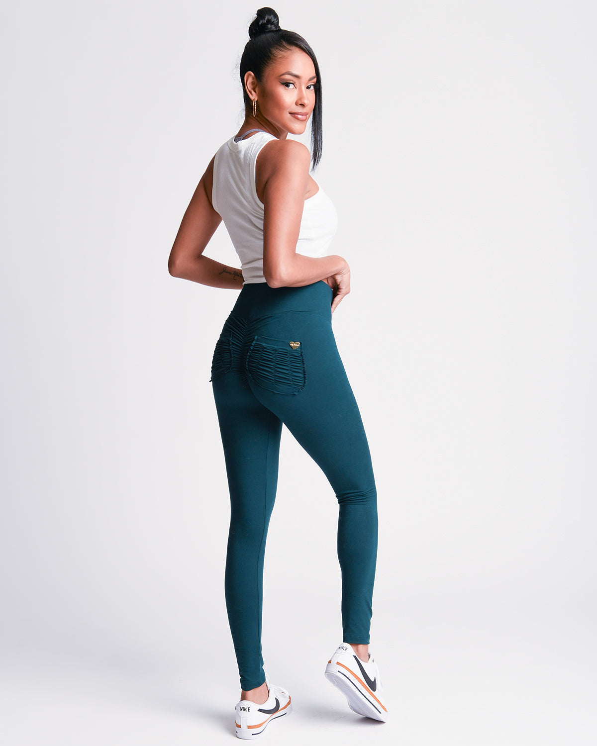 Close up view of the back of green *Soft Sculpt* (Yoga Brush Leggings)