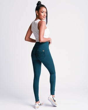 Close up view of the back of green *Soft Sculpt* (Yoga Brush Leggings)