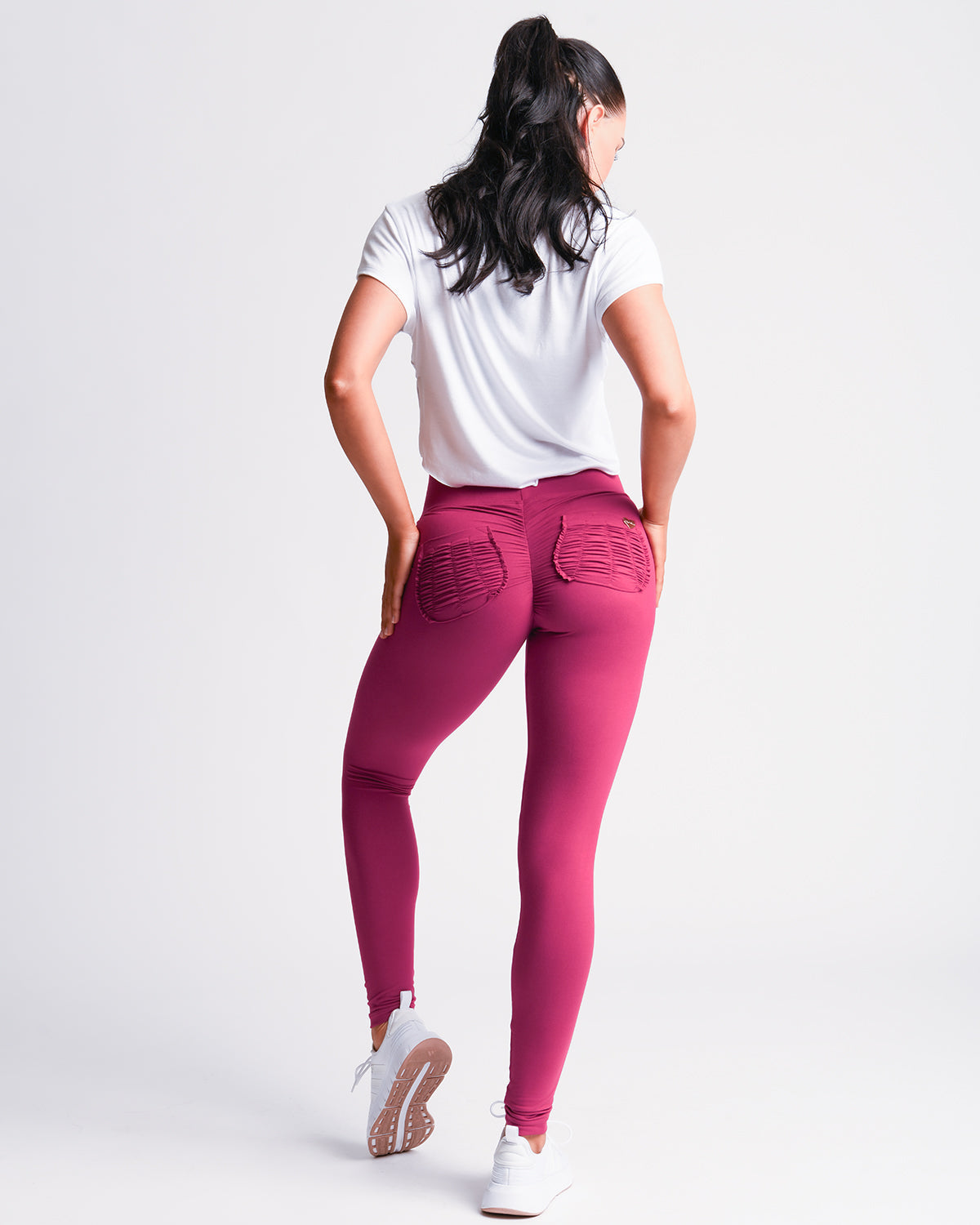 Zoom in view of the back of pink *Soft Sculpt* (Yoga Brush Leggings)