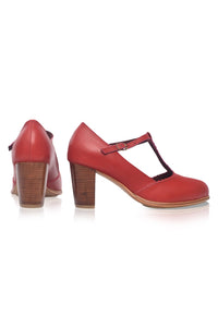 Red high-heeled shoes with a strap on a white background