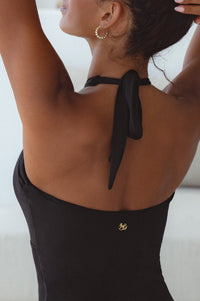 Model showing top of Iliana Cross-Over One Piece Swimsuit 