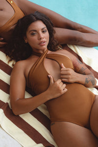 Women at pool side wearing brown Iliana Cross-Over One Piece Swimsuit 