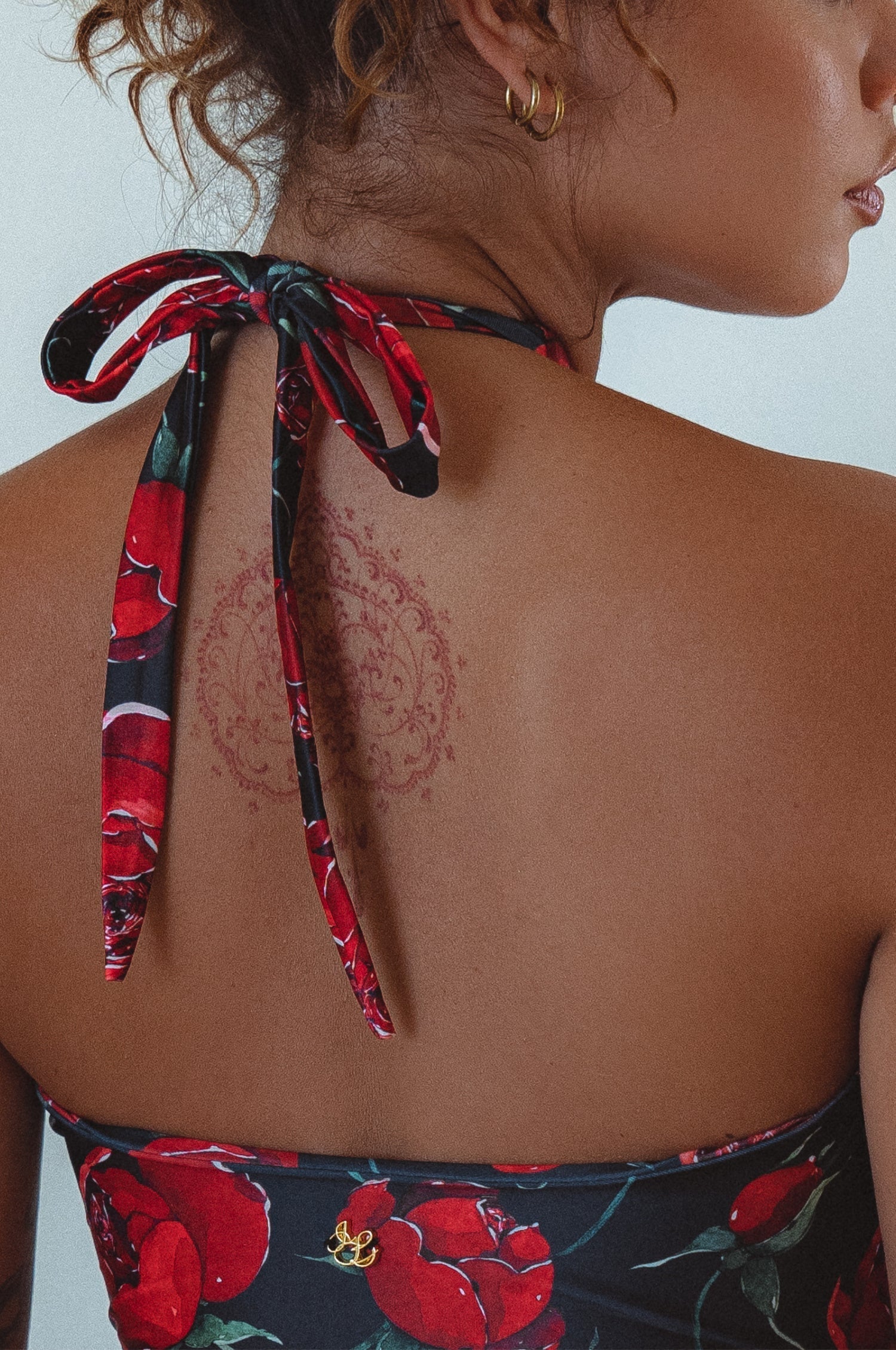 Model showing the back of Iliana Cross-Over One Piece Swimsuit 