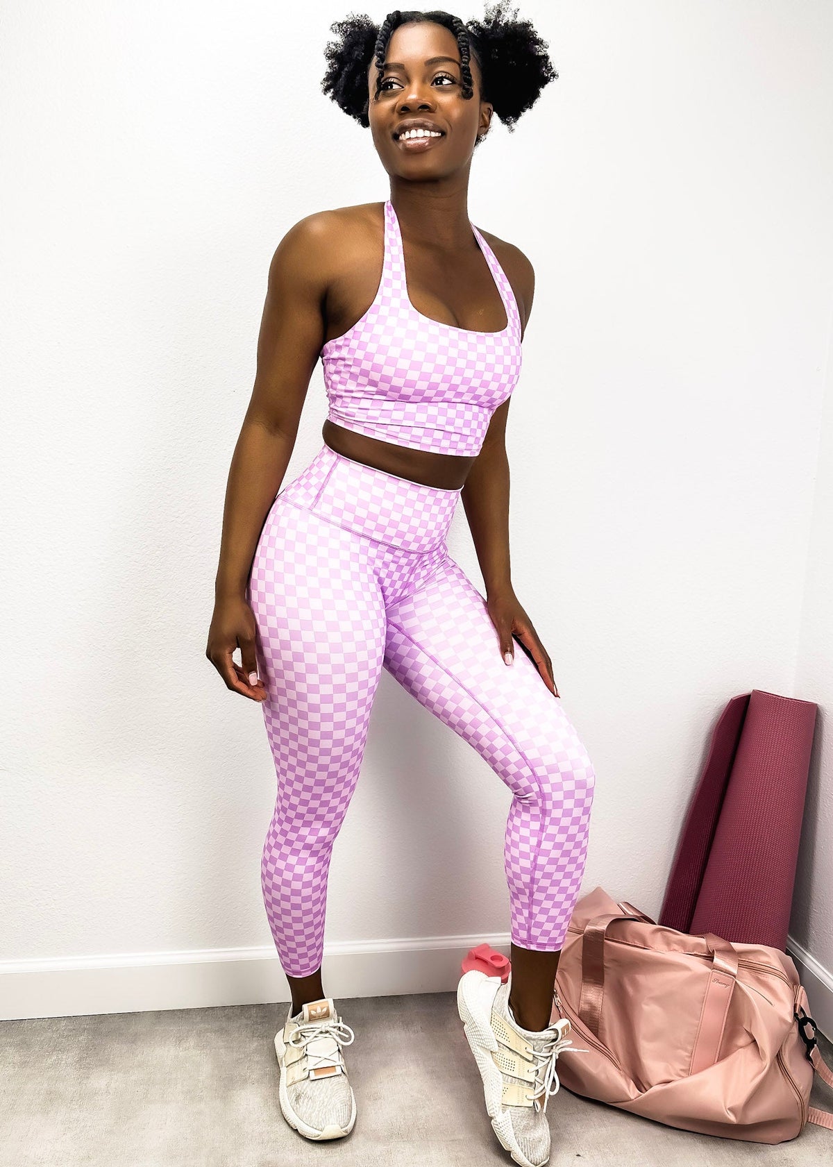 A front pose by model wearing Checkered High Rise 7/8 Leggings-light pastel pink