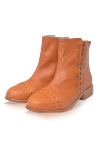 Pair of brown leather ankle boots with stud details on a white background