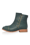 Green ankle boot with gold studs on a white background