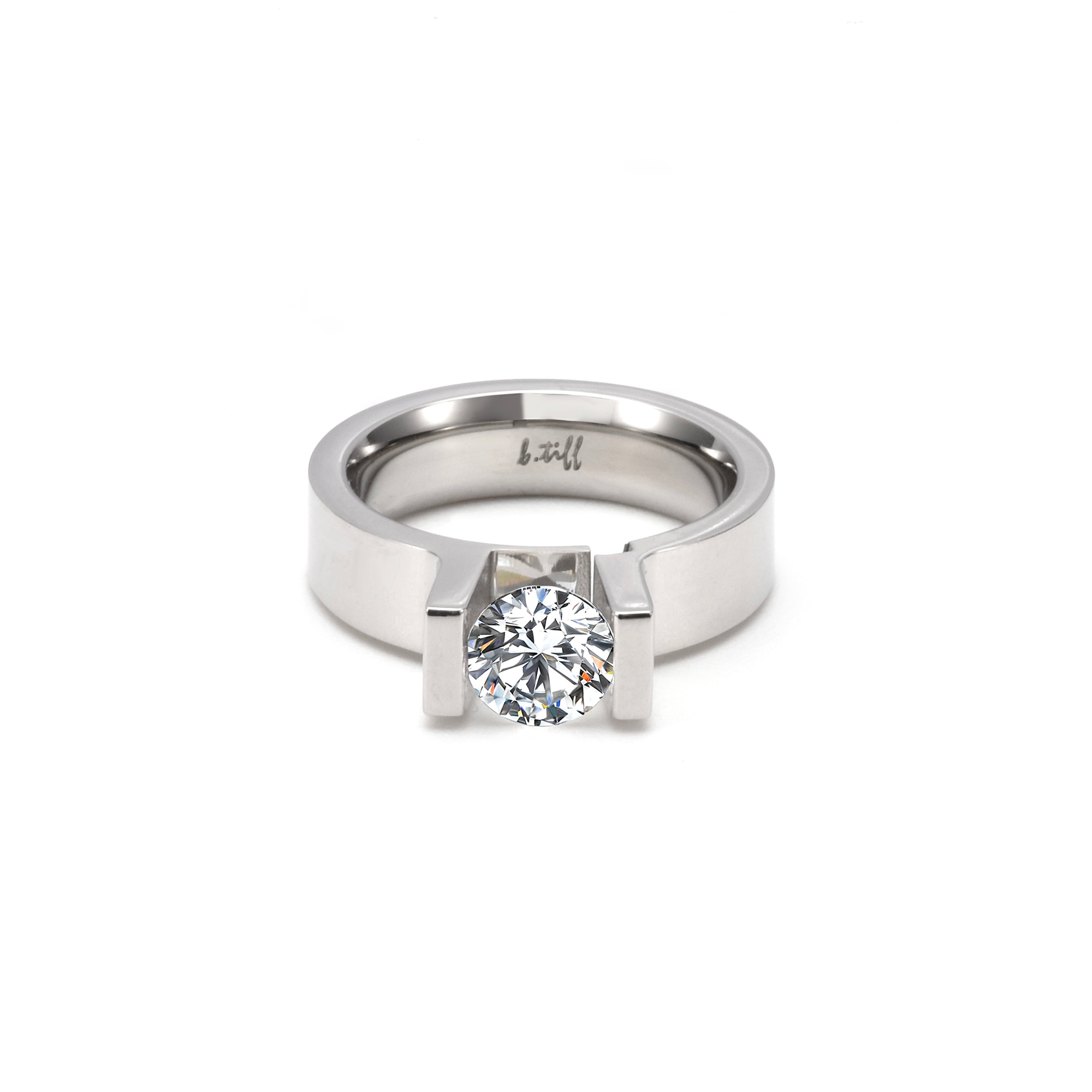 A view of  B.Tiff Tension 1 ct Moissanite Round Solitaire Engagement Ring laying flat
