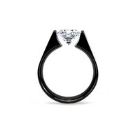 A black solitaire engagement ring with a round moissanite stone set in a polished band.