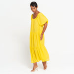 woman showing ROSEMARY Dotted Cotton Dress, in Sunflower Yellow