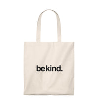Beige tote bag with 'be kind.' text on a white background