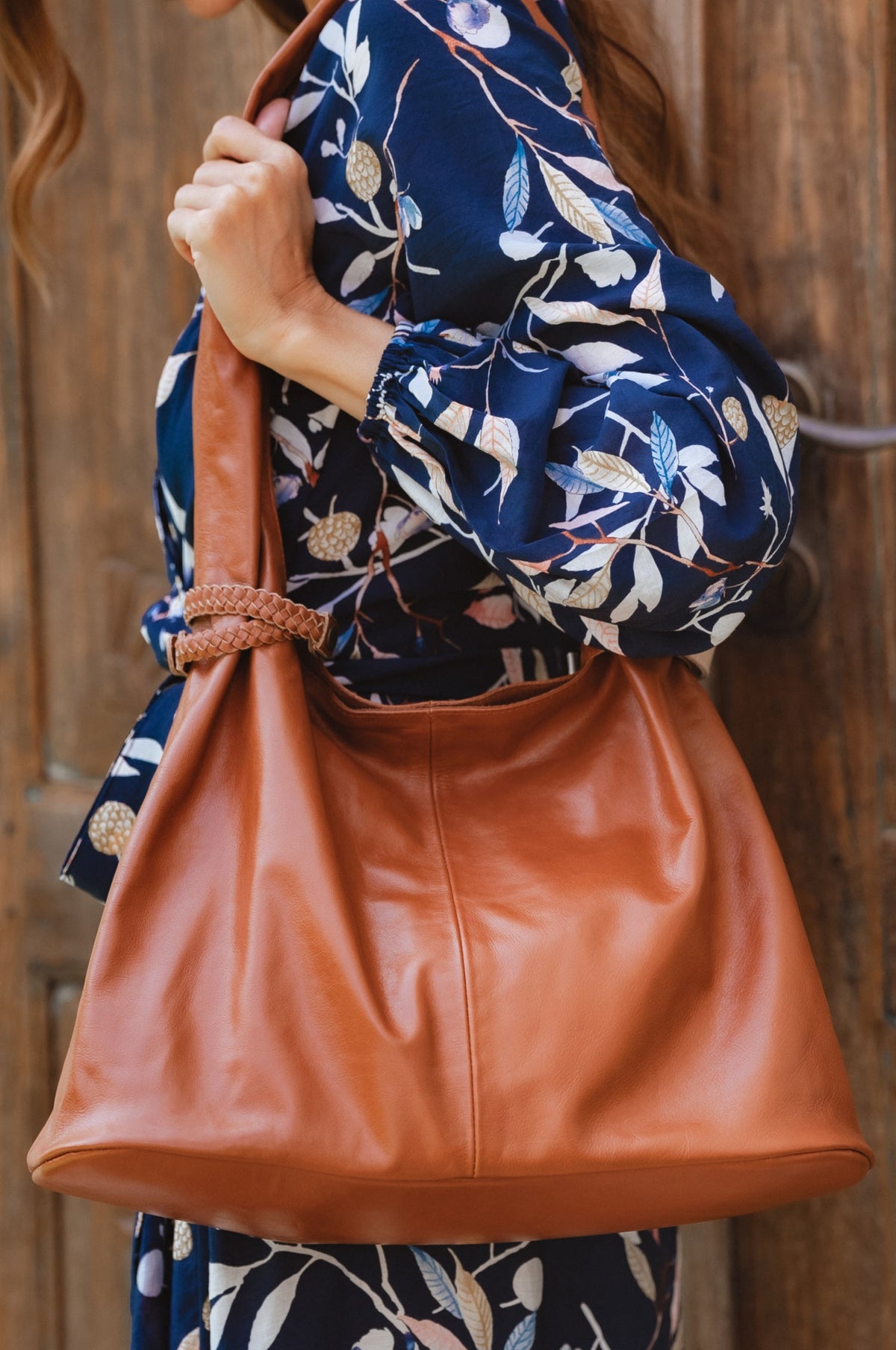 woman carrying Serendipity Vintage Camel handbag