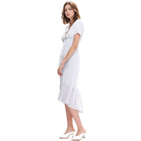 Woman wearing a white dress on a white background