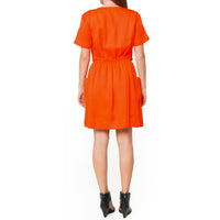 Woman showing the back of Women's Short Sleeve Utility Dress in Poppy