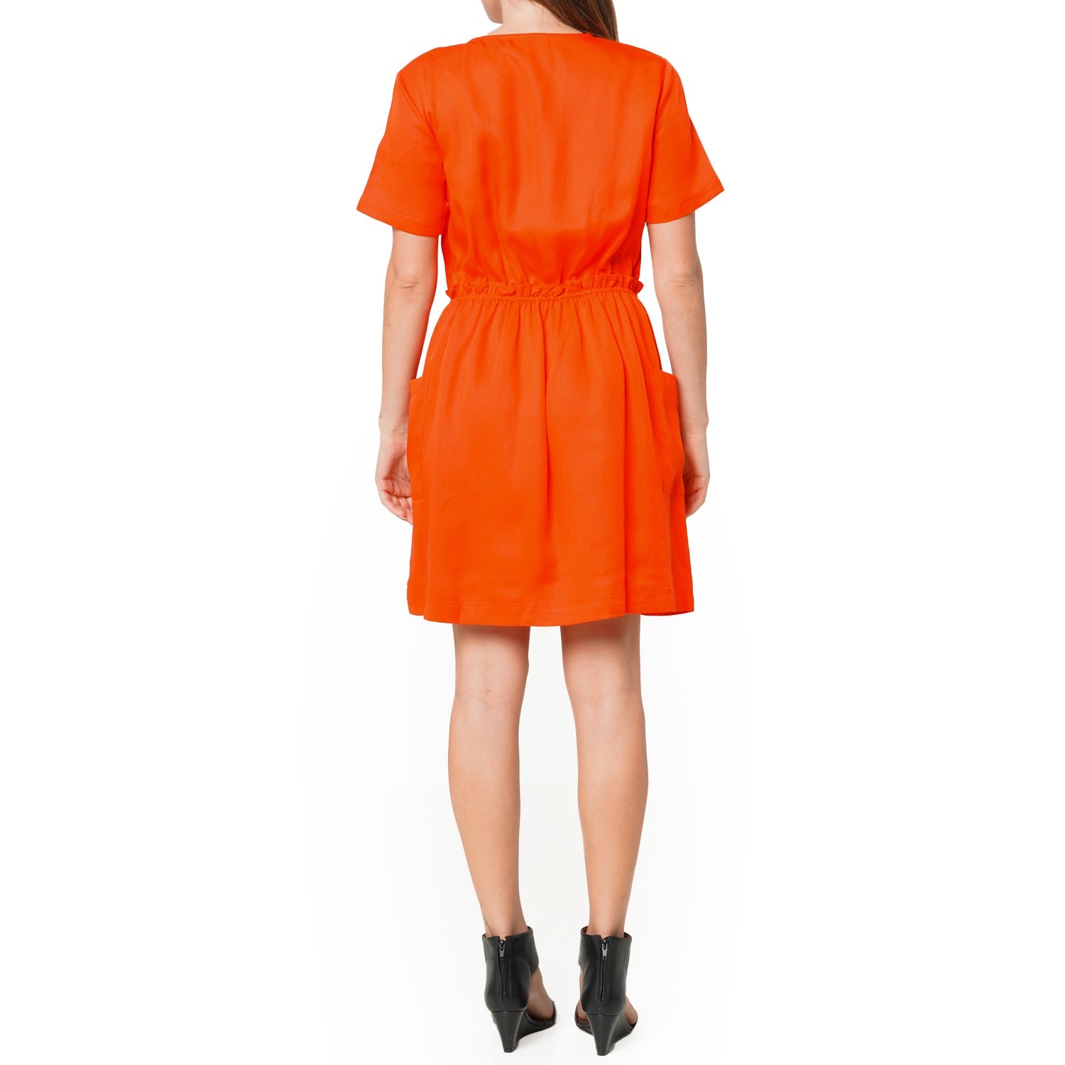 Woman showing the back of Women's Short Sleeve Utility Dress in Poppy