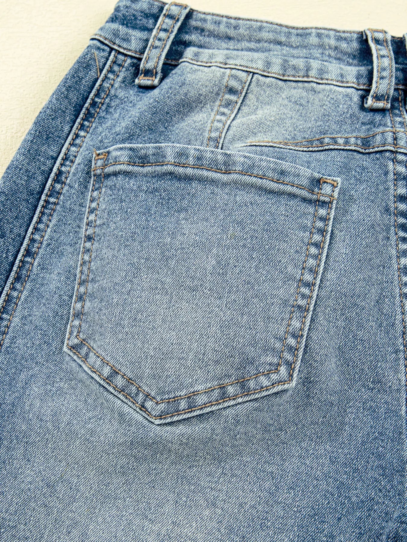 Close-up of a blue denim pocket on jeans.