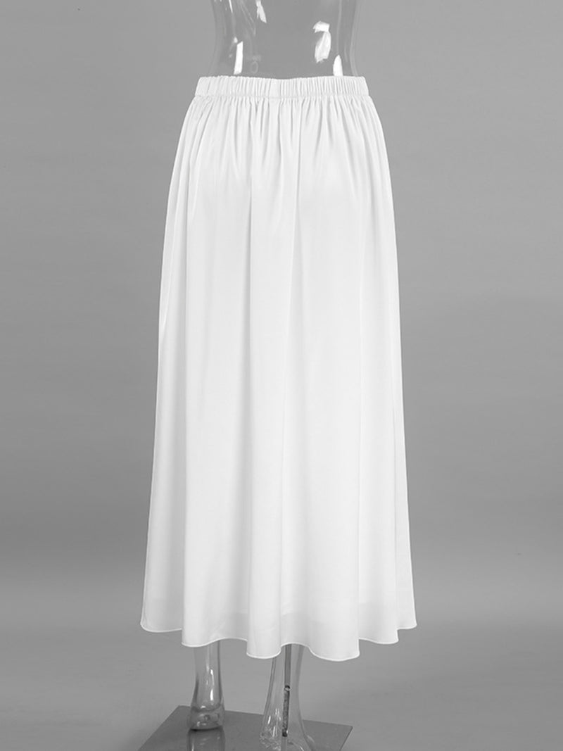 White skirt on a mannequin against a gray background