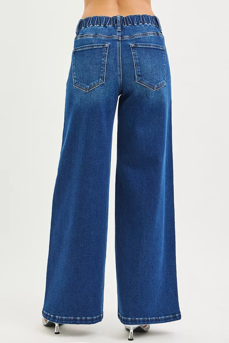 Blue wide-leg jeans on a white background