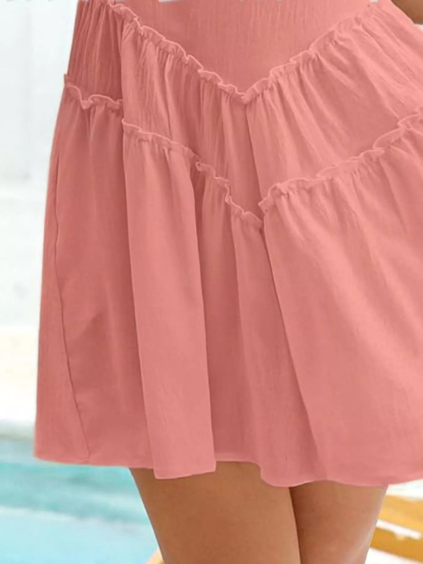 Close-up of a pink skirt with ruffled details on a blurred background