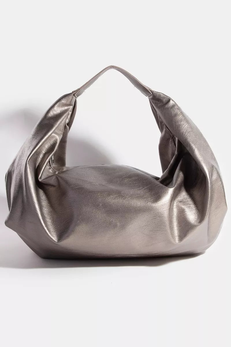 Metallic silver handbag on a white background