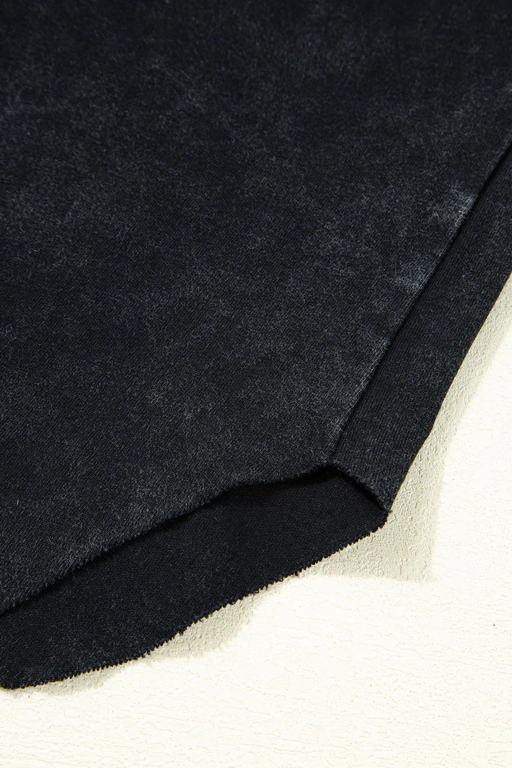 Close-up of dark blue fabric on a light background