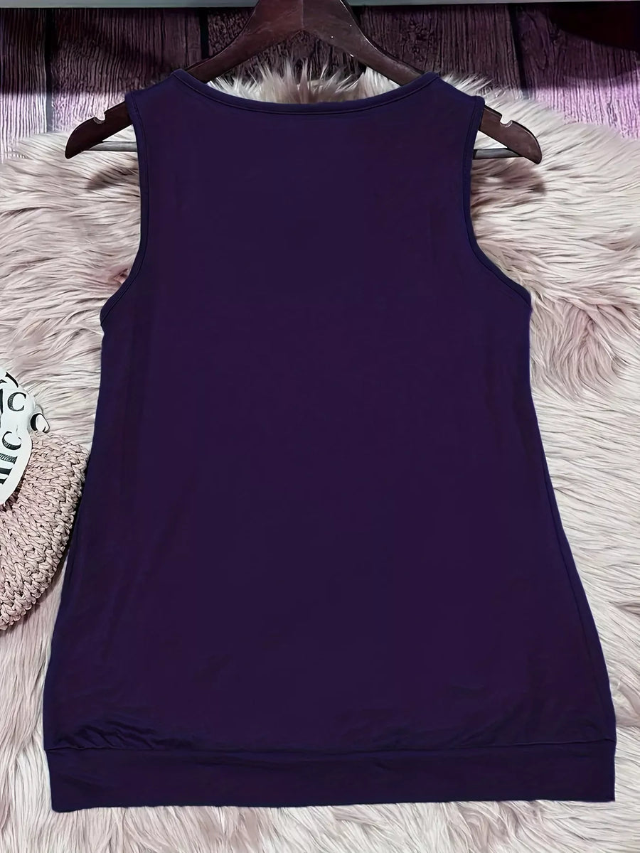 Purple tank top on a hanger against a textured white surface