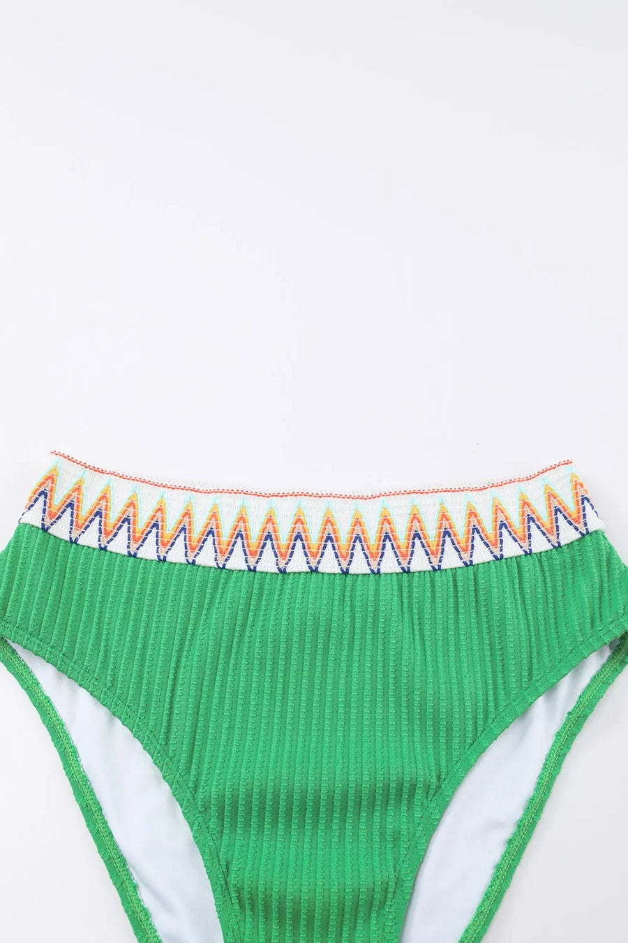 Green bikini bottom with colorful waistband on a white background