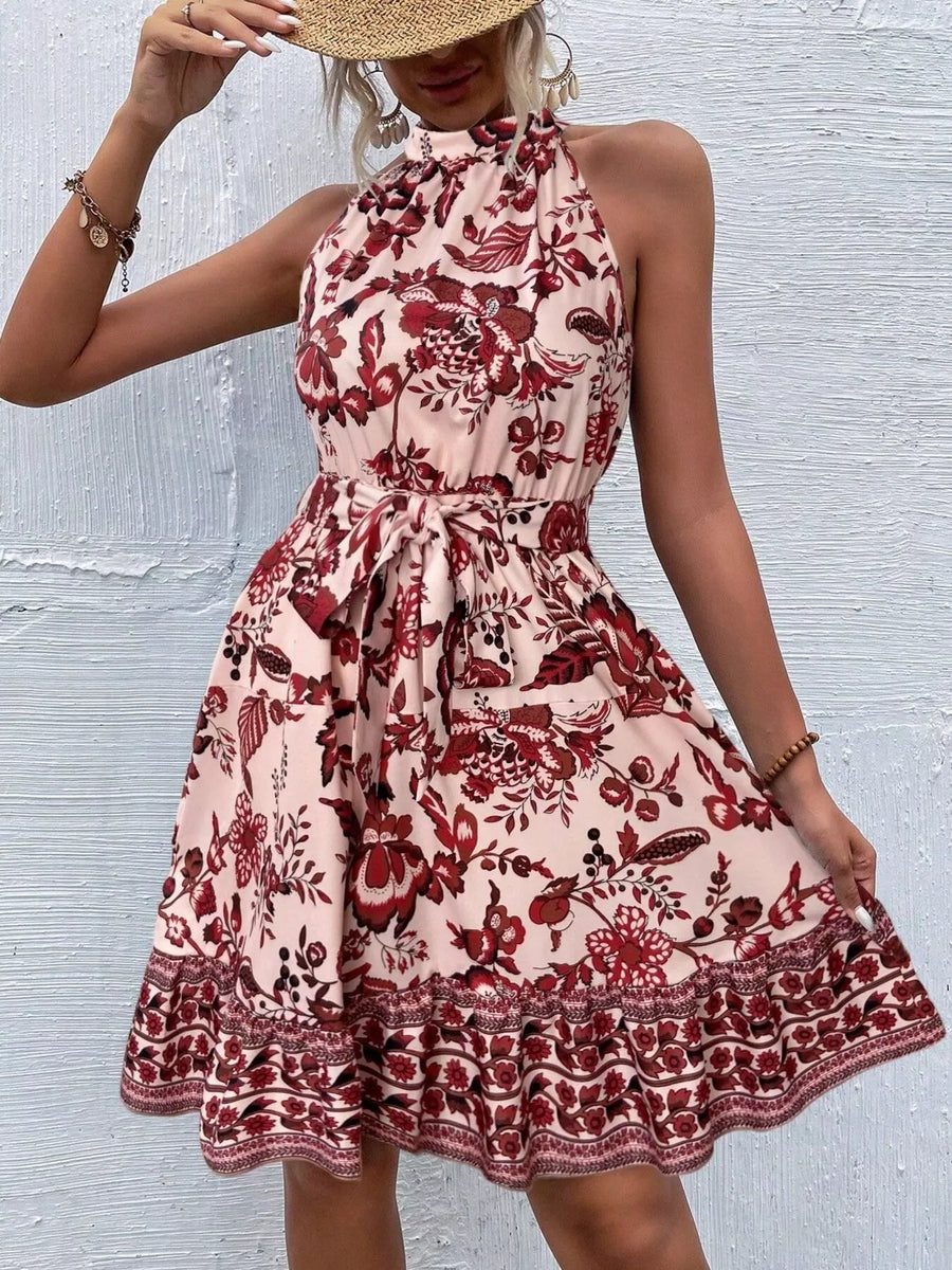 Woman wearing a floral dress with a textured white background