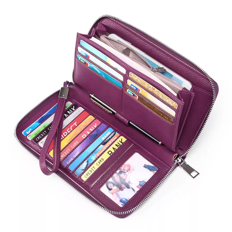 Purple wallet with multiple card slots and a photo window on a white background