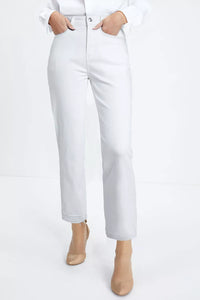 Person wearing white jeans and beige boots on a white background
