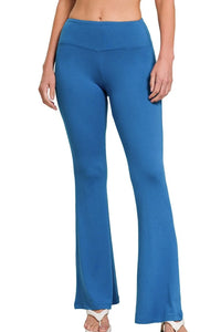Blue pants worn by a person on a white background