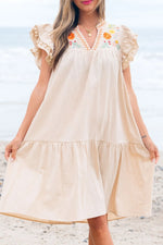 Close up view of beige dress