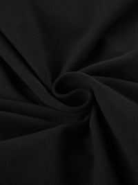 Close-up of black fabric with folds